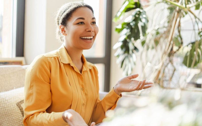 smiling-african-american-woman-learning-and-communicating-in-sign-language.jpg